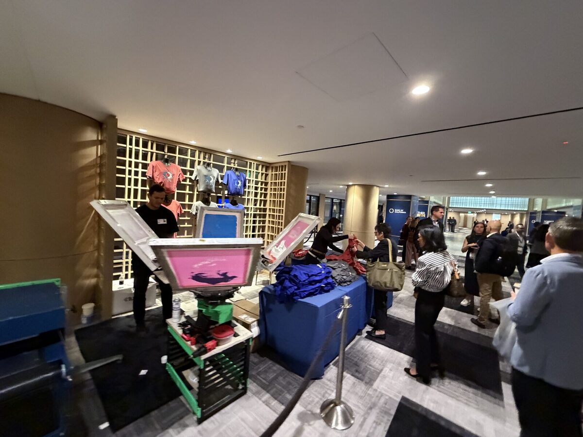 Colorful live printing stations set up in a hotel lobby for a corporate event